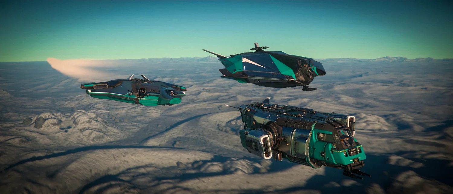 A formation of Star Citizen ships flying over snowy mountains